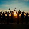 people silhouette during sunset